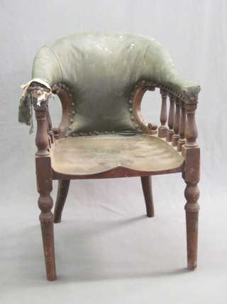 A William IV mahogany tub back library chair with spindle decoration (spindles require some attention) raised on turned supports