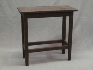 A rectangular carved oak occasional table, raised on square supports 24"