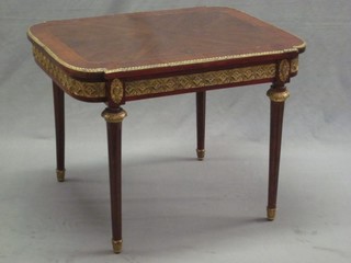 A French rectangular shaped Kingwood occasional table with gilt metal mounts, raised on turned and fluted supports 27"