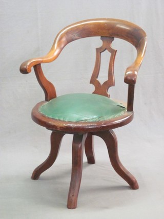 A Victorian mahogany tub back revolving office chair