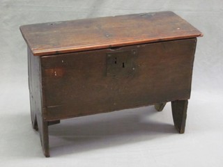 An 18th Century small oak coffer of panelled construction, the interior fitted a candle box 28"