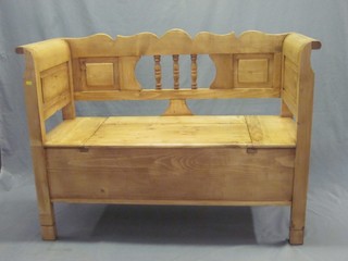 A Continental stripped and polished pine settle 49"