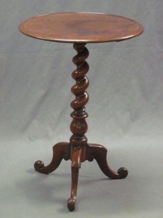 A 19th Century circular mahogany wine table, raised on a spiral turned column 18"