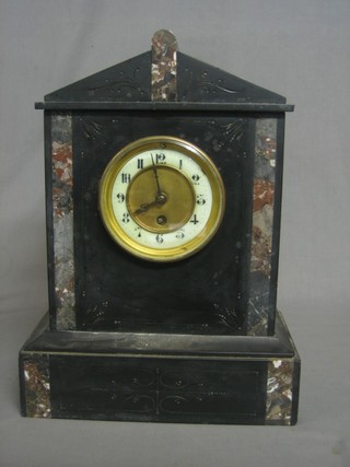 A Victorian French 8 day mantel clock with enamelled dial contained in a black veined architectural case