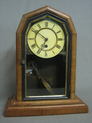 An American 8 day shelf clock with enamelled  dial and Roman numerals contained in a walnut case
