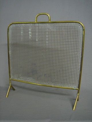 A brass and mesh spark guard