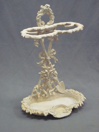 A reproduction Victorian white painted iron umbrella stand