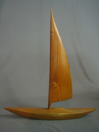 A wooden model of a yacht 15"