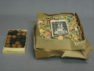 A set of dominoes and a wooden jigsaw puzzle