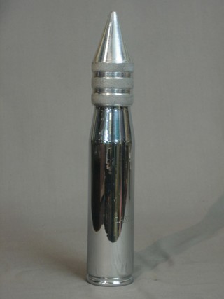 A  table lighter formed from a chromium plated shell case marked Castellamari 1944  11"