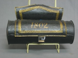 A 19th Century black painted cylindrical candle box marked 1802 12"