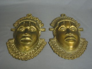 A pair of cast metal masks 11"