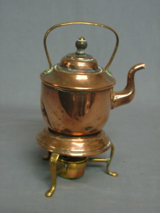 A circular copper spirit kettle