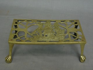 A pierced brass rectangular footman decorated a galleon 10"