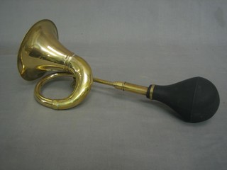 A reproduction brass taxi horn