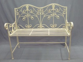 A white metal framed folding garden bench 41"