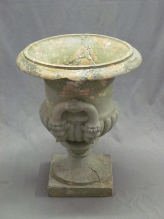 A 19th Century twin handled garden urn of campanular form 21" (chip to rim)