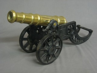 A brass canon with pierced iron trunion 18"