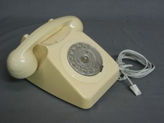 A yellow dial telephone