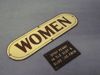 A rectangular brown and white enamelled sign marked Women 9" together with a brown and white Bakelite sign marked Drop Penny in Slot