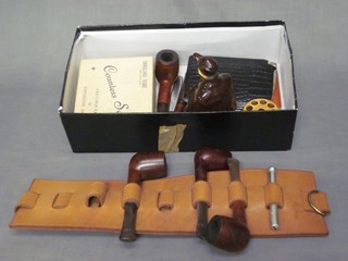 A collection of various pipes, cigarette cases and other smoking related items