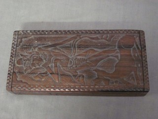 A rectangular carved Eastern hardwood box with hinged lid 8"