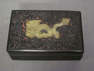 A pierced Eastern hardwood trinket box, the lid set green hardstone figure of a dragon 6"