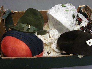 A lady's white petal style hat, a green felt pixie style hat, a brown felt hat with white banding, a purple and blue banded hat and 1 other