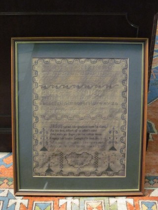 A Victorian wool work sampler with letters, alphabet and religious motto by ?? Leo, dated 1834 16" x 12"