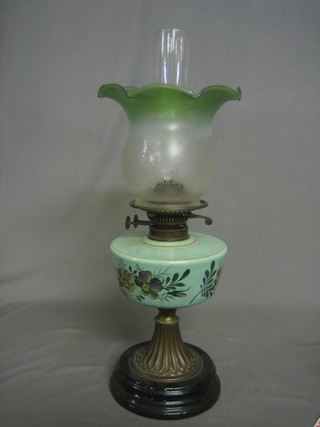 A Victorian turquoise glass oil lamp with green glass shade