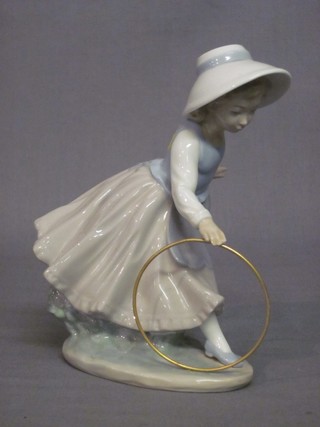 A Nao figure of a girl with hoop (boxed) 7"