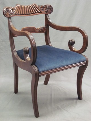 A William IV carved mahogany bar back carver chair with shaped mid rail and upholstered drop in seat, raised on sabre supports 