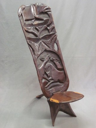 An Eastern  wooden high backed chair, carved animals
