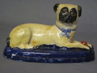 A 19th Century Staffordshire figure of a seated Pug with ball 7"