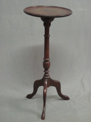 A turned mahogany wine table, raised on pillar and tripod column 11"