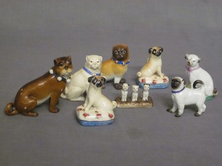 A 19th Century Continental porcelain figure of a seated Pug 3", 1 other 2" and 3 various figures of seated Pugs