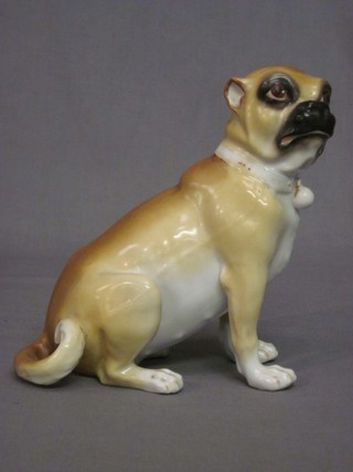 A 19th Century German porcelain figure of a seated Pug, the base incised 513 7"
