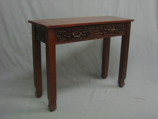 An Eastern hardwood side table fitted 2 drawers with blind fret work decoration, raised on square supports 39"