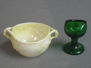 A circular Beleek twin handled sugar bowl, the base with black mark 3" and a green glass eye bath