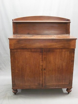 A 19th Century mahogany chiffonier with raised back, the base fitted a drawer above a double cupboard enclosed by panelled doors, raised on bun feet 38"