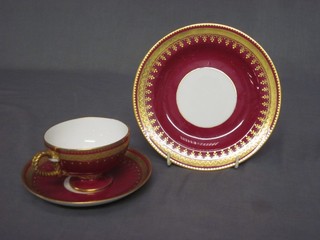 A Victorian red and gilt glazed trio comprising cup, saucer and plate