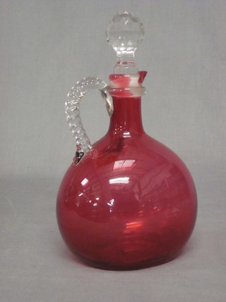 A Victorian cranberry glass ewer with clear glass handle 8"