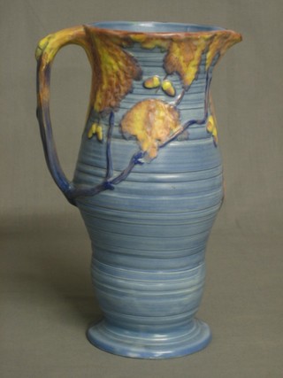 A blue glazed Carltonware jug decorated oak leaves 10"