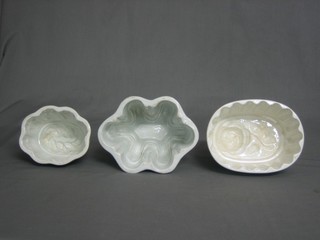 3 white glazed pottery jelly moulds (1 with chip to base)