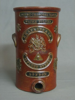 A cylindrical Victorian salt glazed water filter, marked Patented Charcoal Block Water Filter, F H Atkins & Co. 62 Fleet Street London (missing lid and no spicket) 14"