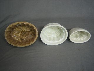 3 white glazed jelly moulds