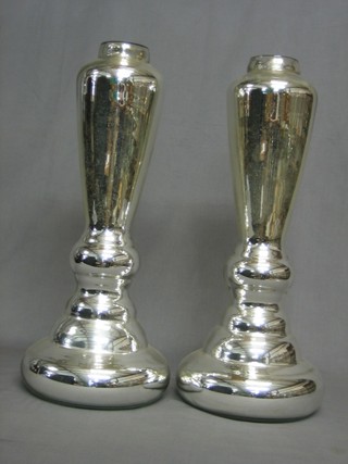 A pair of silver coloured glass lamp bases 20"