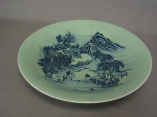 An Oriental blue and white charger decorated landscape scene 16" (f)