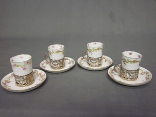 4 Royal Crown Derby coffee cans and saucers contained in silver mounts
