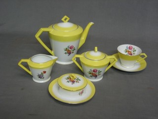 A Noritake yellow glazed tea service with floral decoration comprising 10" circular plate, 5 tea plates 6 1/2", teapot, lidded sucrier, milk jug, butter dish, 6 cups and 6 saucers